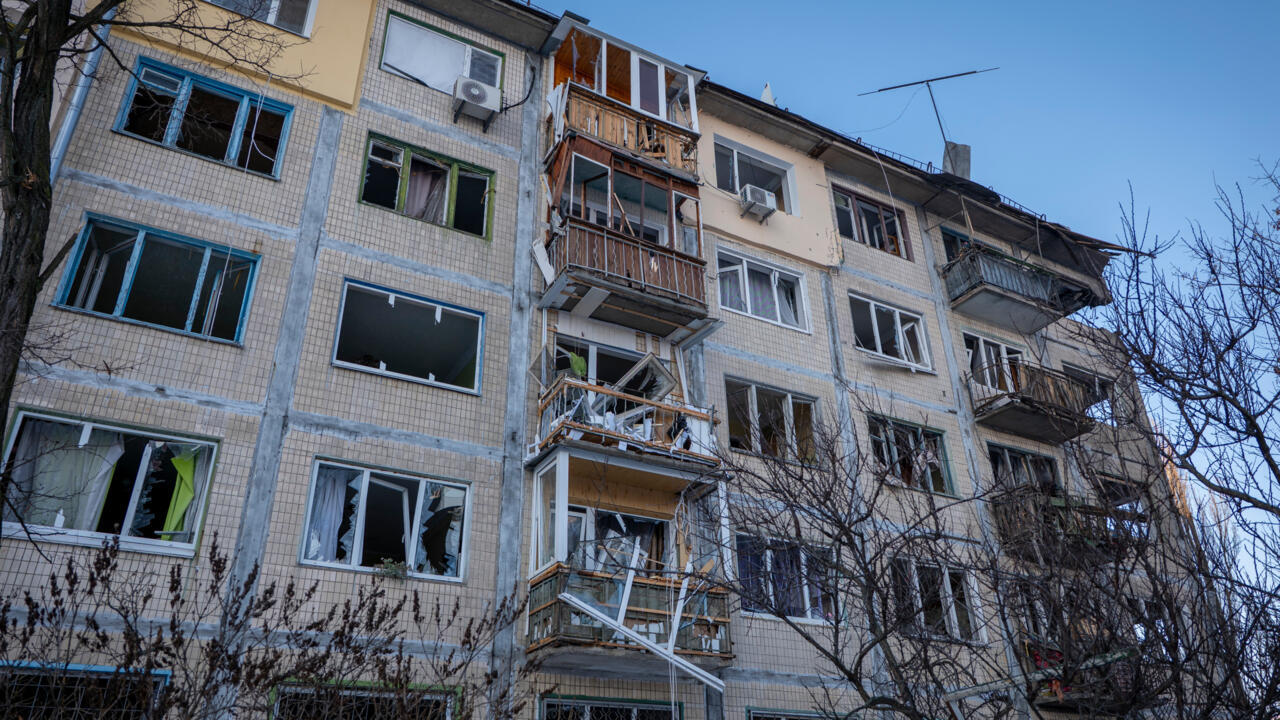 A damaged apartment house is seen following Russia