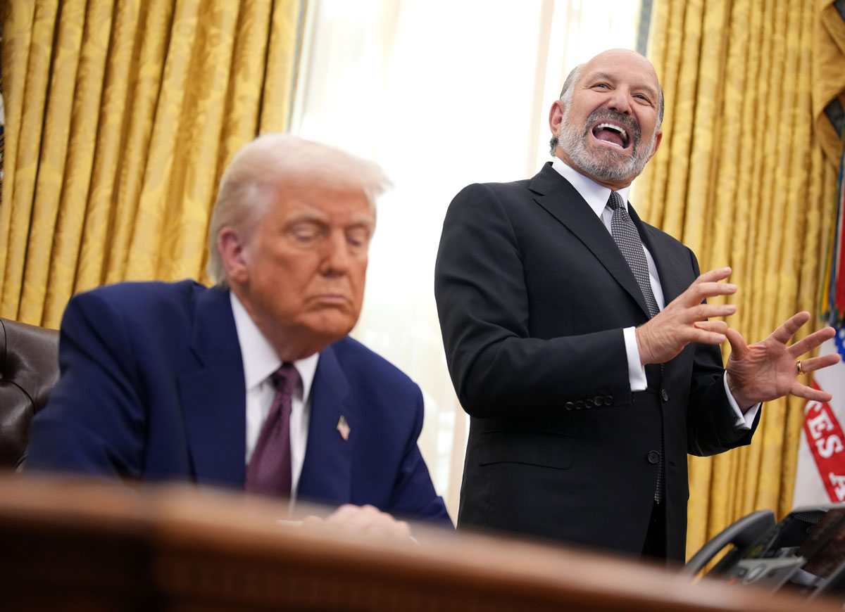 WASHINGTON, DC - FEBRUARY 13: Secretary of Commerce Howard Lutnick (R) speaks alongside U.S. President Donald Trump after Trump signed an executive order on reciprocal tariffs in the Oval Office at the White House on February 13, 2025 in Washington, DC. Trump announced his plan to increase U.S. tariffs to match the rates other nations charge to import American goods. (Photo by Andrew Harnik/Getty Images)