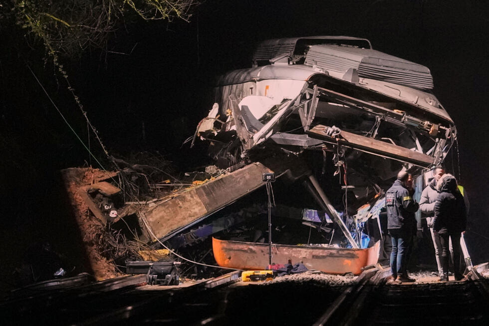 Emergency crews at the scene of a commuter train crash in Barcelona on January 20. The crash further rattled Spaniards reeling from a deadly collision between two high-speed trains two days earlier.