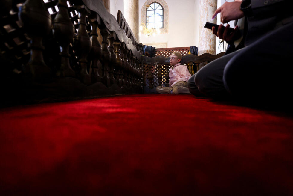 A Muslim boy attends Eid al-Fitr prayers marking the end of the holy fasting month of Ramadan at Gazi Husrev-beg Mosque in Sarajevo, Bosnia and Herzegovina.