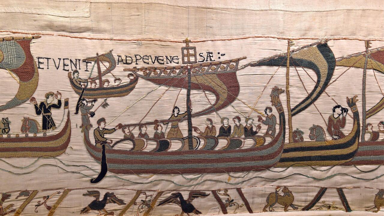This photo provided by the Ville de Bayeux shows a technician inspecting the tapestry in Bayeux, Normandy.