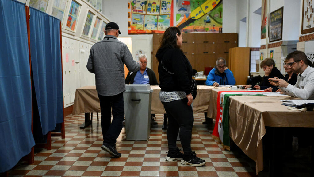 People vote at a polling station during the Hungarian parliamentary election in Budapest, Hungary, April 12, 2026. 