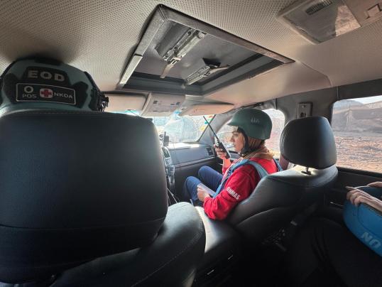 UNMAS security officer in a convoy of UN personnel
