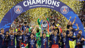 PSG captain Marquinhos lifts the Champions League title at the Puskas Arena in Budapest.