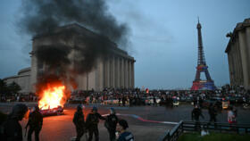 A car was set ablaze opposite the Eiffel Tower during the street celebrations.