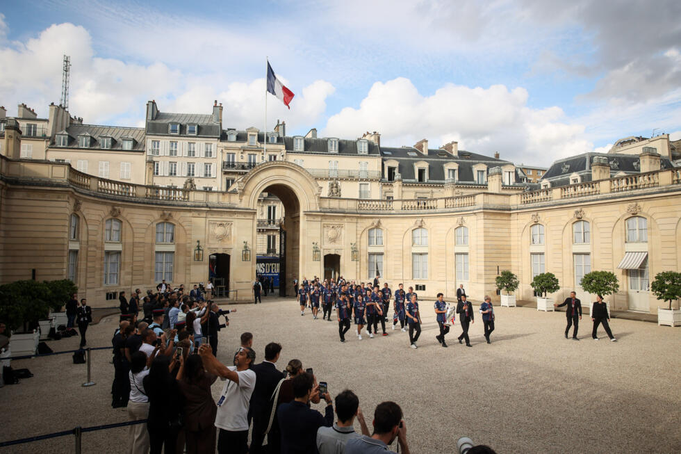 The players arrive for a ceremony at the Élysée Palace hosted by French President Emmanuel Macron.
