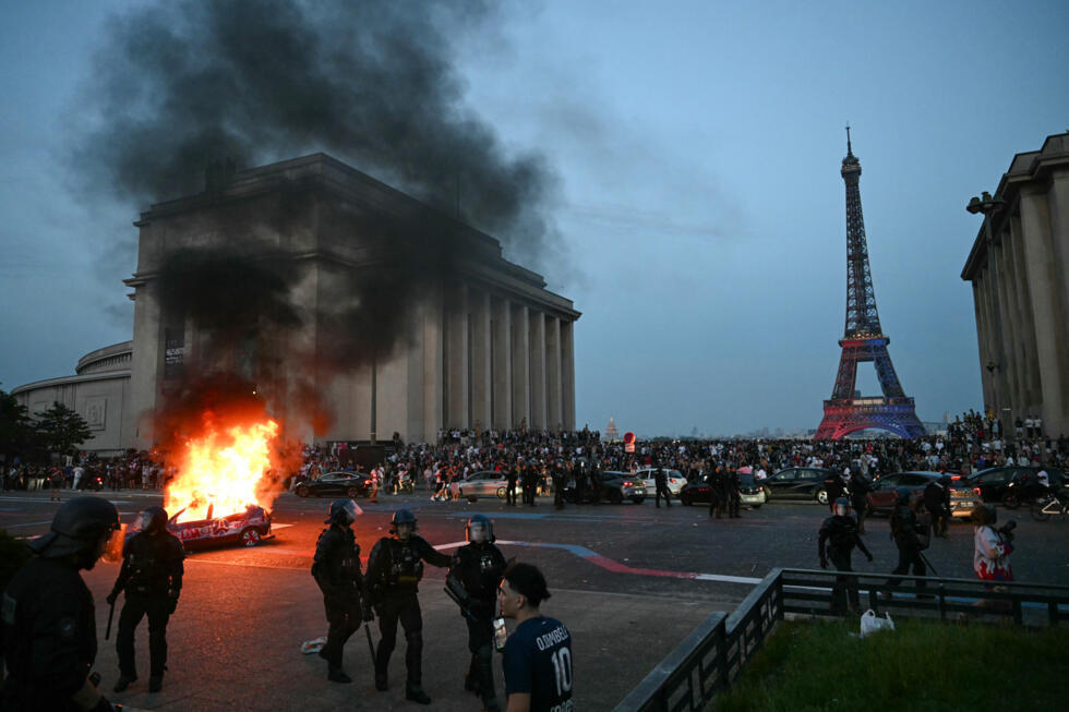 A car was set ablaze not far from the Eiffel Tower during street celebrations on Saturday night.