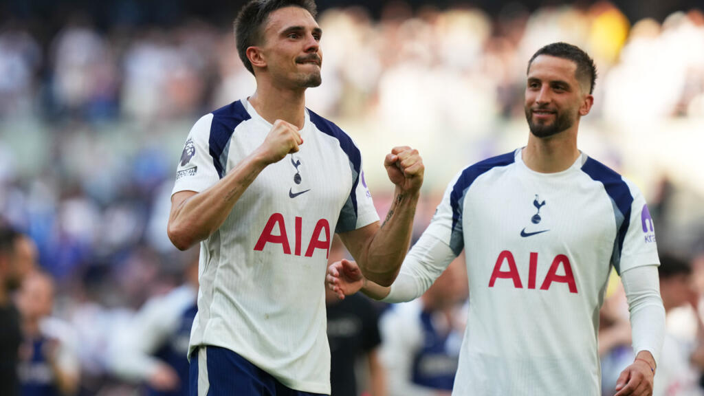 Tottenham's Joao Palhinha, left, and Tottenham's Rodrigo Bentancur celebrate after beating Everton during the English Premier League soccer match in London, England, Sunday, May 24, 2026