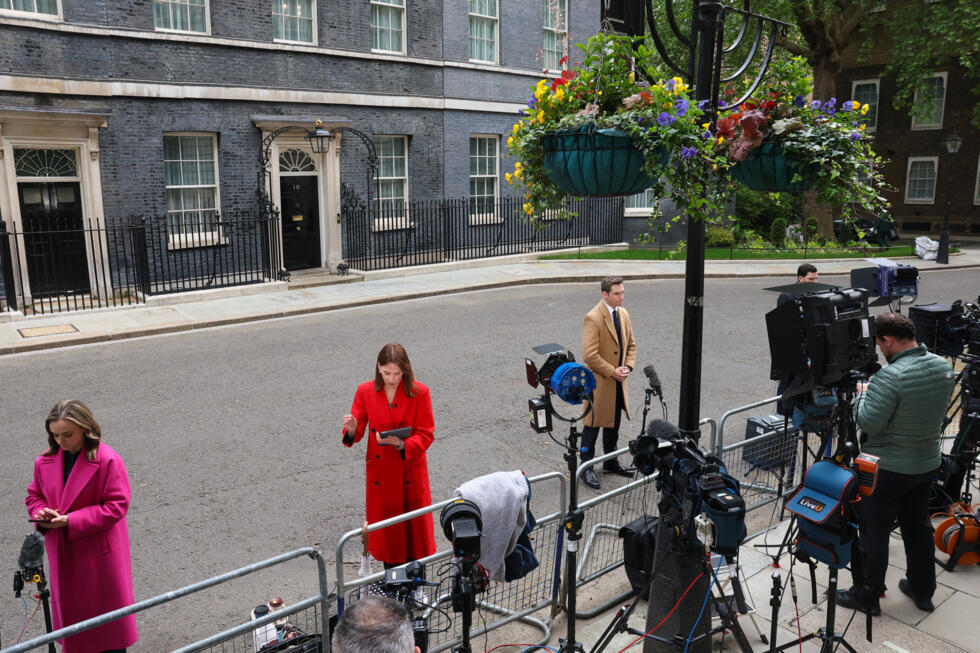 Members of the media gather at Downing Street in London on May 11, 2026 as rumours swirl that Prime Minister Keir Starmer may soon resign