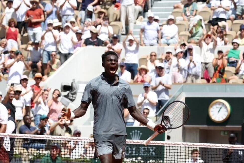 Young French player Moïse Kouamé celebrates his victory in the second round of the French Open in Paris on May 28, 2026.