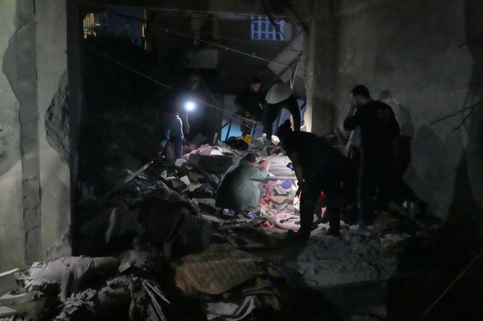 Rescue workers search for survivors in the rubble of an apartment building destroyed by an Israeli airstrike in the city of Sidon, Lebanon, on May 28, 2026.