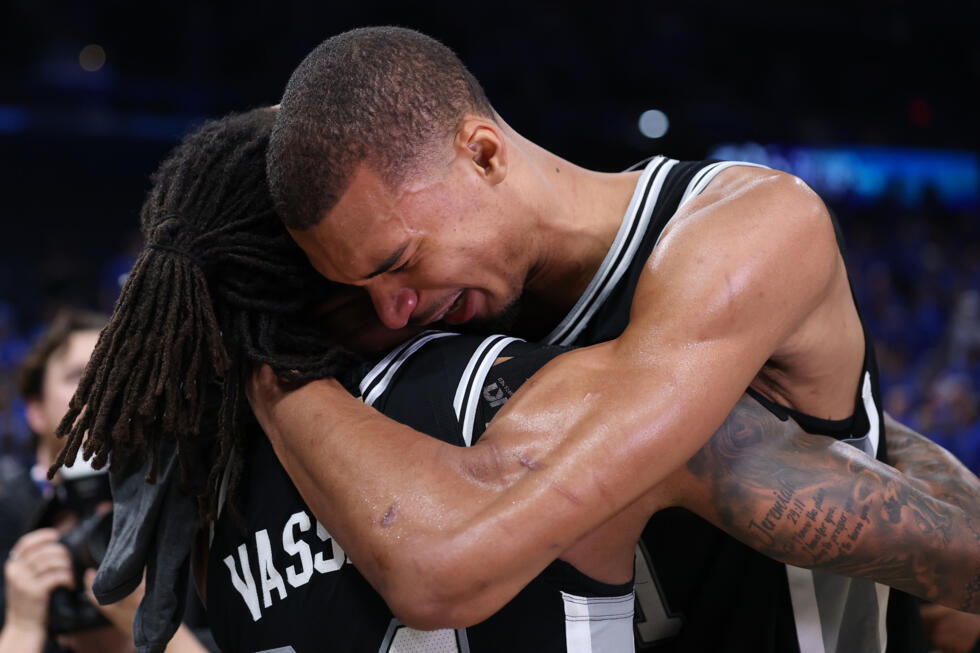 Victor Wembanyama embraces team-mate Devin Vassell after San Antonio's victory over Oklahoma City