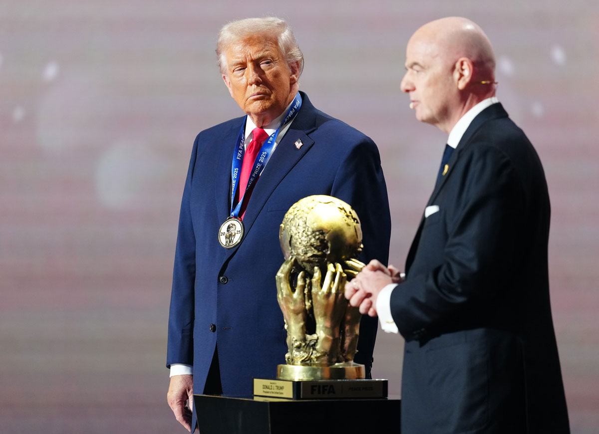 WASHINGTON, DC - DECEMBER 05: U.S. President Donald Trump receives the FIFA Peace Prize from Gianni Infantino, President of FIFA, during the FIFA World Cup 2026 Official Draw at John F. Kennedy Center for the Performing Arts on December 05, 2025 in Washington, DC. (Photo by Jia Haocheng - Pool/Getty Images)