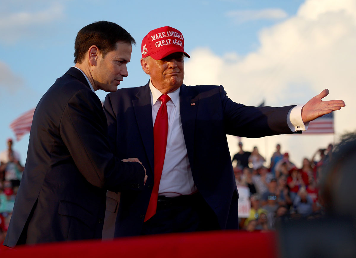 MIAMI, FLORIDA - NOVEMBER 06: Former U.S. President Donald Trump invites Sen. Marco Rubio (R-FL) to speak at the microphone during a rally at the Miami-Dade County Fair and Exposition on November 6, 2022 in Miami, Florida. Rubio faces U.S. Rep. Val Demings (D-FL) in his reelection bid in Tuesday