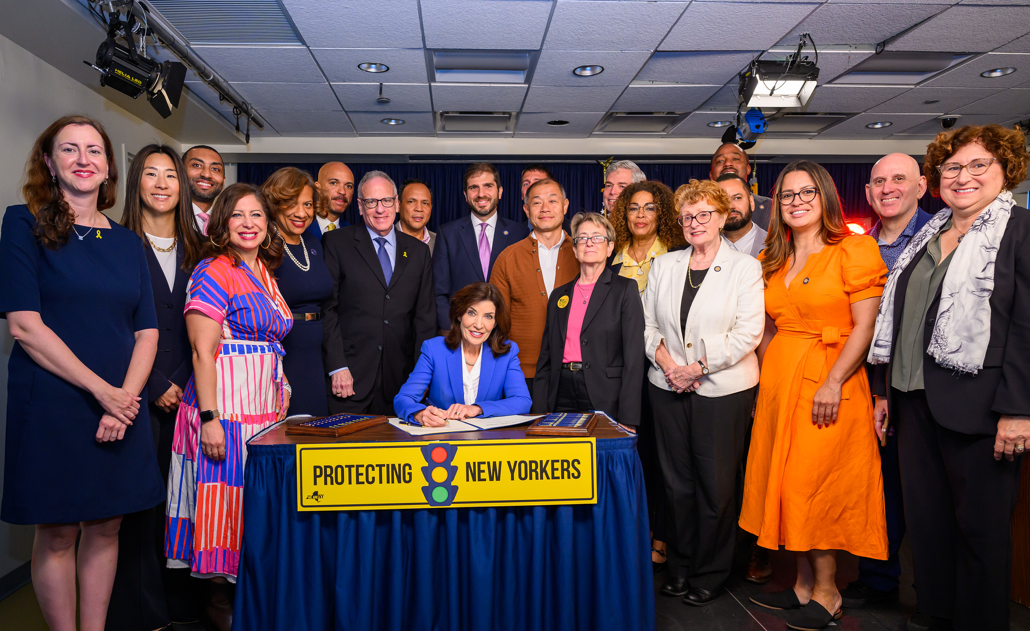 Assemblymember Grace Lee (second from left) attends a 2024 traffic safety bill signing event with Gov. Kathy Hochul.