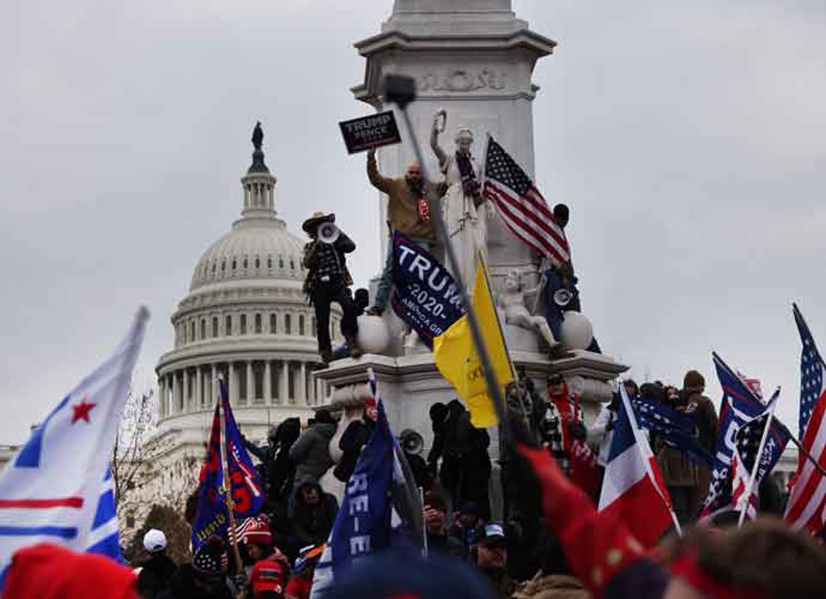 WASHINGTON, DC - JANUARY 06: Trump supporters gather outside the U.S. Capitol building following a "Stop the Steal" rally on January 06, 2021 in Washington, DC. A pro-Trump mob stormed the Capitol earlier, breaking windows and clashing with police officers. Trump supporters gathered in the nation