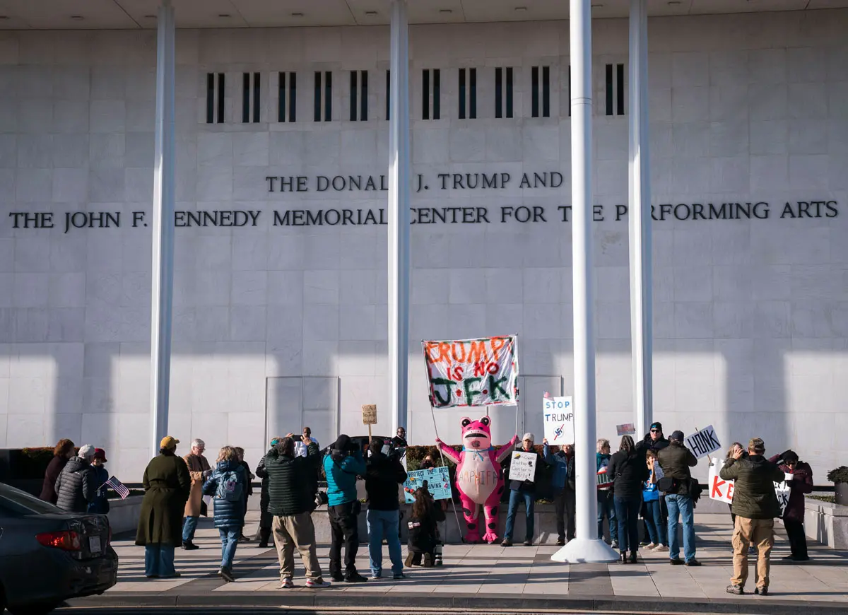 WASHINGTON, DC - DECEMBER 19: Workers begin adjusting the name of the “John F. Kennedy Memorial Center for the Performing Arts