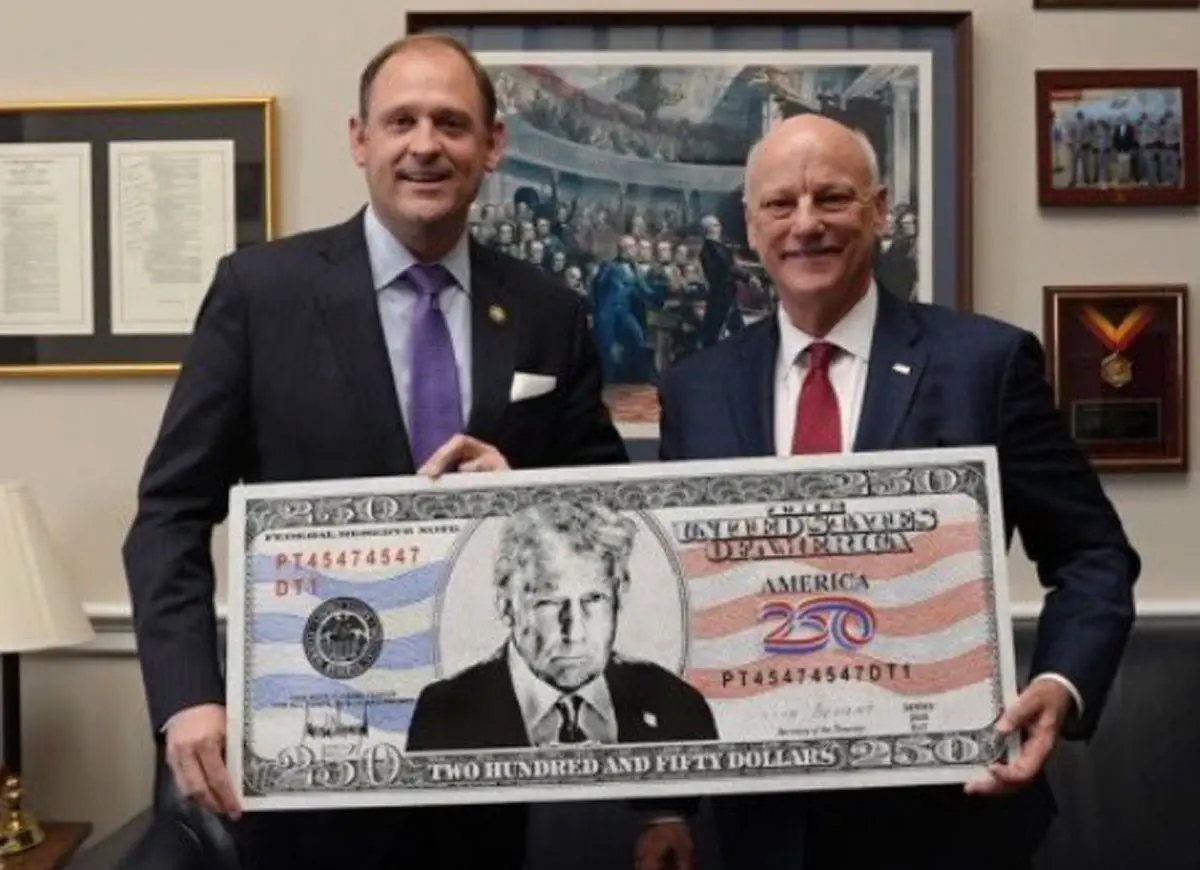 Rep. Andy Barr holds a Trump $250 bill (Image: X)