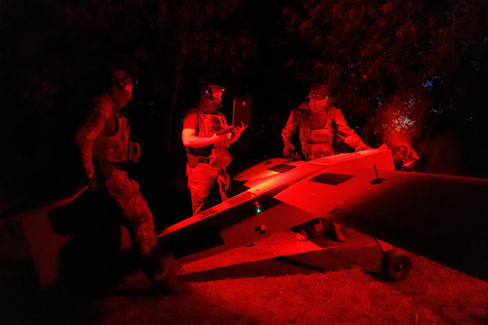 Service members of the Sparta company of the 422nd Unmanned Systems Regiment "Luftwaffe" of the Ukrainian Armed Forces, prepare a Zozulia mid-strike drone for flight