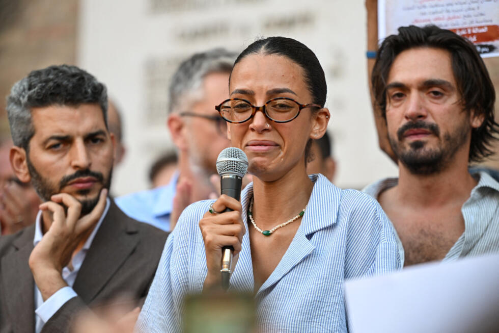 Yossra Fakir, niece of Abderrahim Fakir, reads a statement during a protest following his death in Bologna, Italy