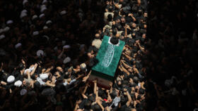 The coffin of Ayatollah Ali Khamenei is carried by mourners to the Imam Ali Shrine in Najaf, Iraq, before returning to Iran for the late Iranian supreme leader's burial.