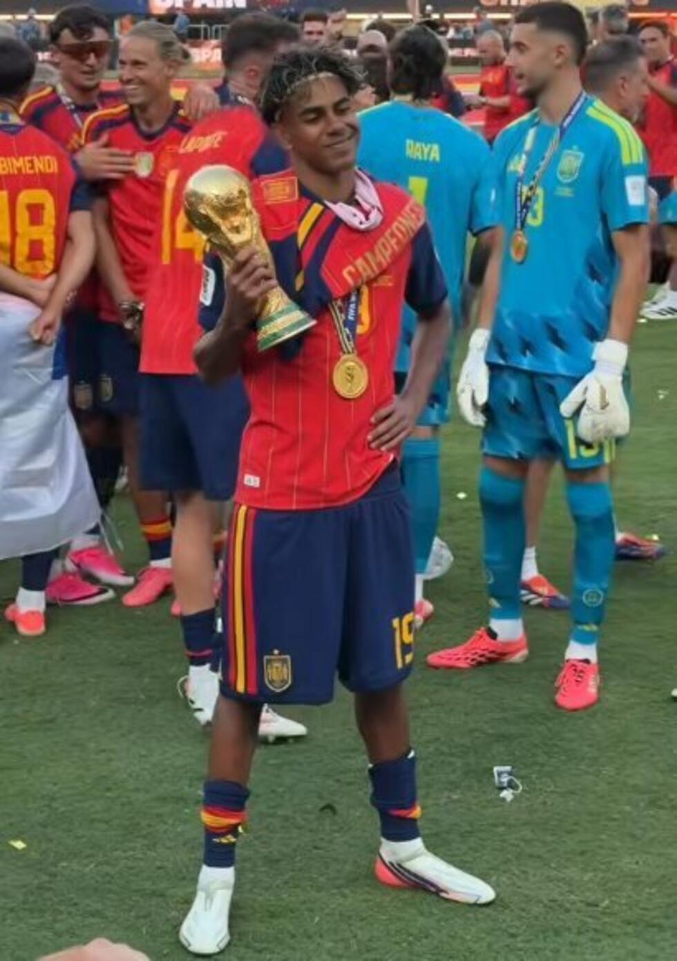 This screengrab of a video broadcast on July 20, 2026 shows Lamine Yamal posing in front of photographers with the World Cup trophy.