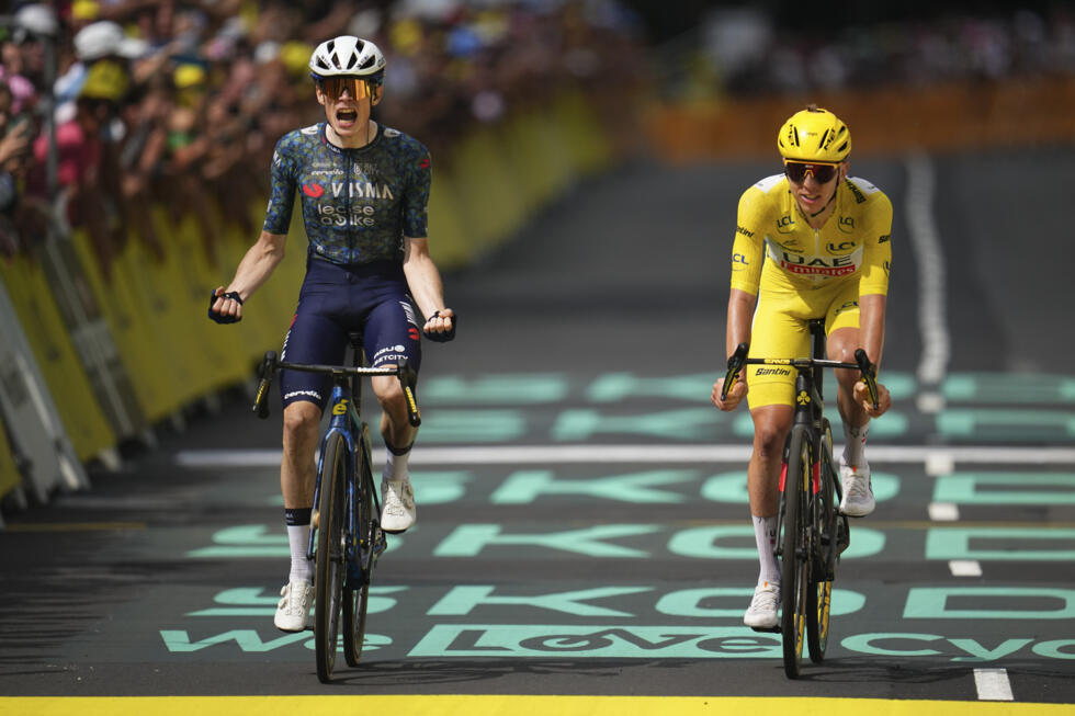 The Dane Jonas Vingegaard celebrates as he crosses the finish line ahead of the Slovenian Tadej Pogacar, winning the eleventh stage of the Tour de France on Wednesday 10 July 2024