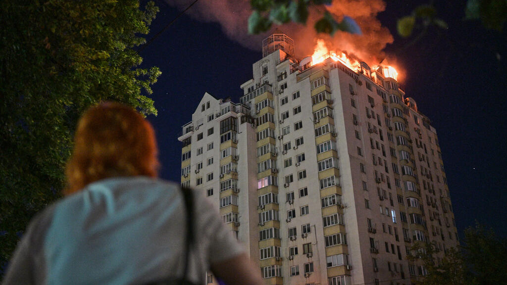 An apartment building burns after an hours-long Russian missile and drone attack on Kyiv on July 2, 2026.