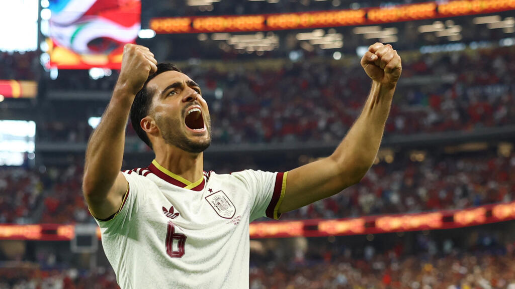 Spain's Mikel Merino celebrates scoring the opener against Portugal.