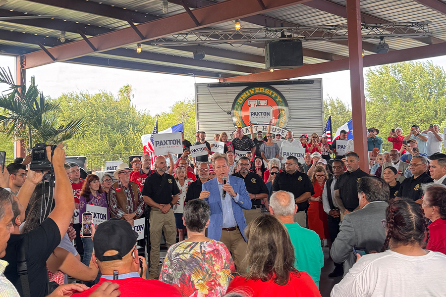 Ken Paxton talking to Tano Tijerina at campaign event in McAllen, Texas.