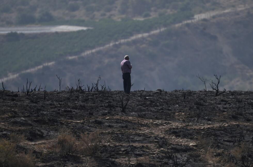 Twelve people died in the blaze, which spread rapidly across parched woodland and scrub