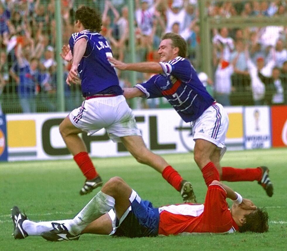 Laurent Blanc is chased by captain Didier Deschamps after scoring the golden-goal winner against Paraguay at the 1998 World Cup.