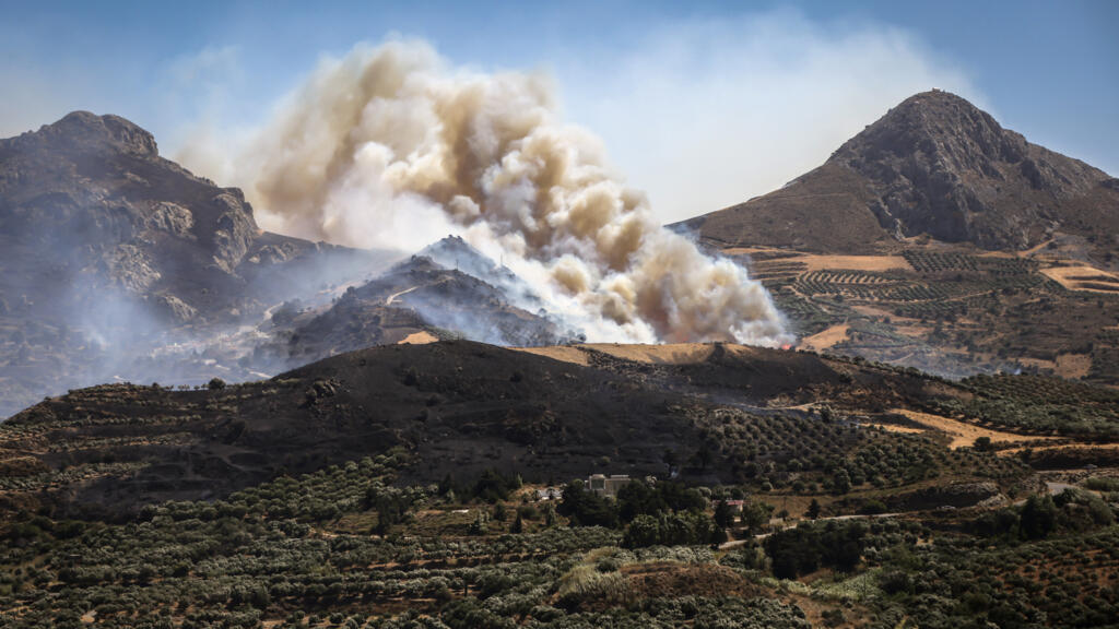 This photograph shows an area engulfed in flames during a wildfire near the village of Asomatos on the Greek island of Crete on July 30, 2026