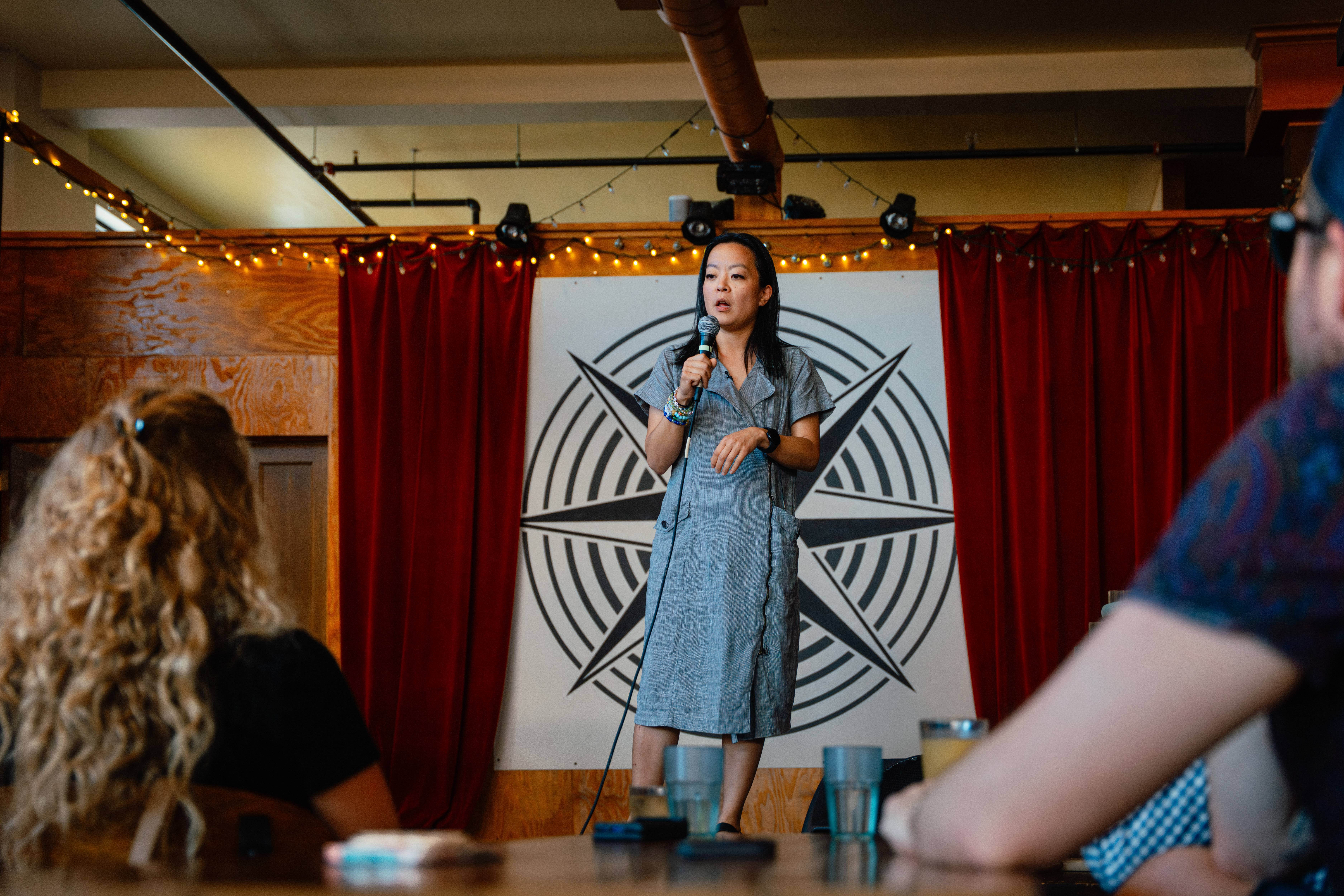 Hong speaks during a campaign event at Paradigm Coffee and Music in Sheboygan.