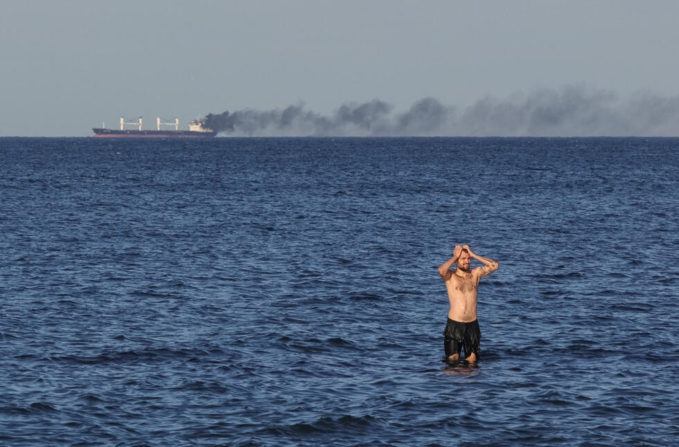 Smoke rises from a civilian vessel on fire near Odesa, Ukraine