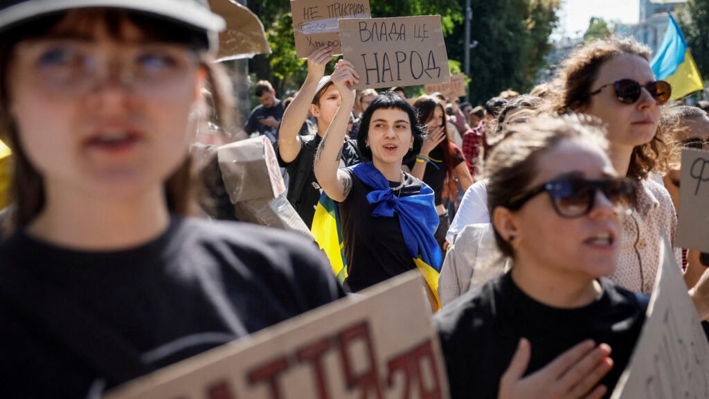 Protesters gather outside Parliament in Kyiv during a rally against Zelensky