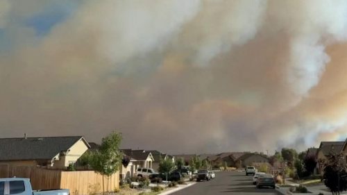 Nevada wildfire forces tens of thousands to evacuate as blaze threatens city of Reno