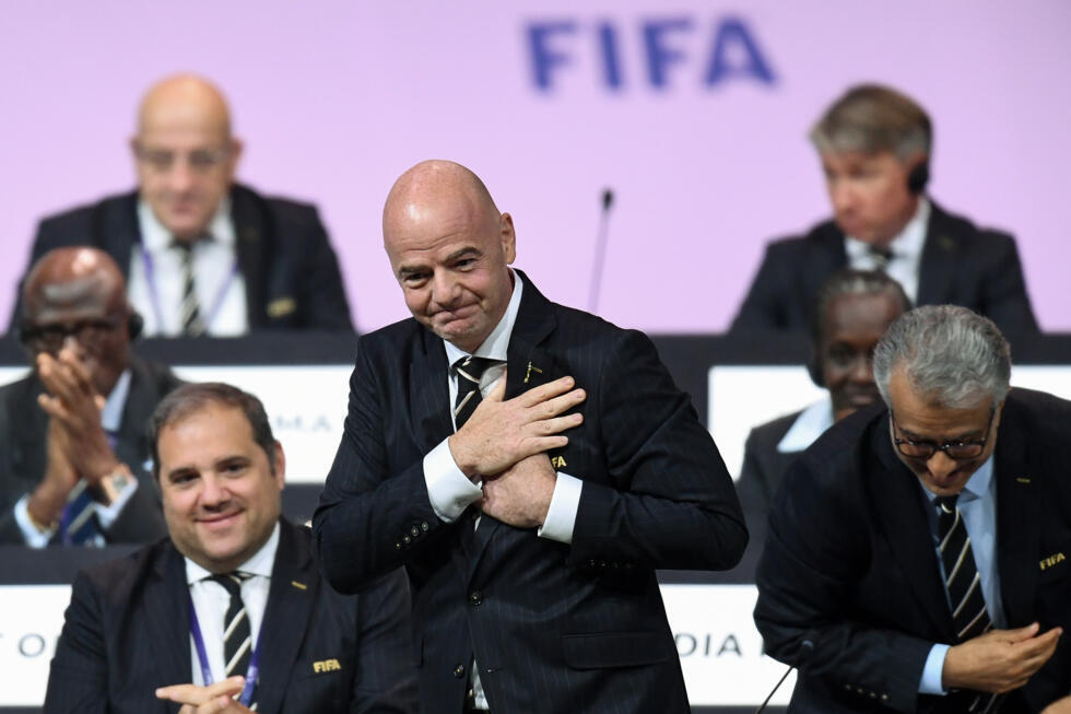FIFA President Gianni Infantino (C) faces mounting problems after UEFA threatened legal action over his shelved plan