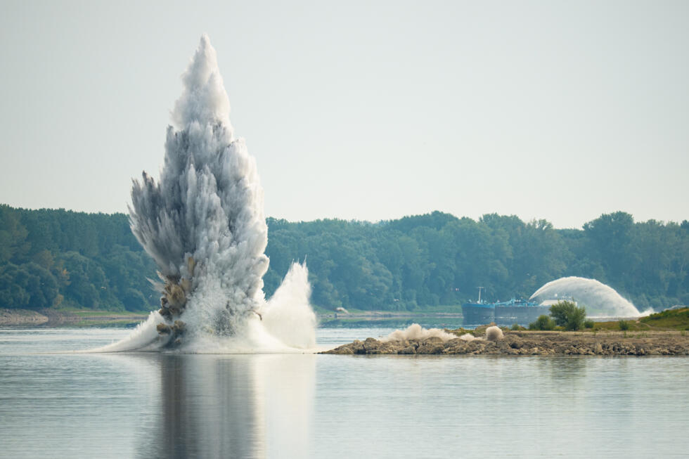 The Romanian Navy detonates underwater explosives during a controlled demolition of submerged rocks to improve water flow to the Cernavoda Nuclear Power Plant amid exceptionally low water levels.