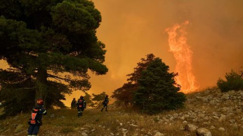 Greece’s wildfires claim lives as firefighters struggle to contain flames