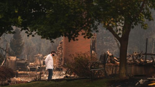 US wildfires force 65,000 to flee as hundreds of buildings burn in Spokane