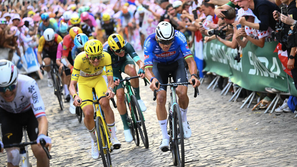 Slovenian rider Tadej Pogacar wearing the overall leader