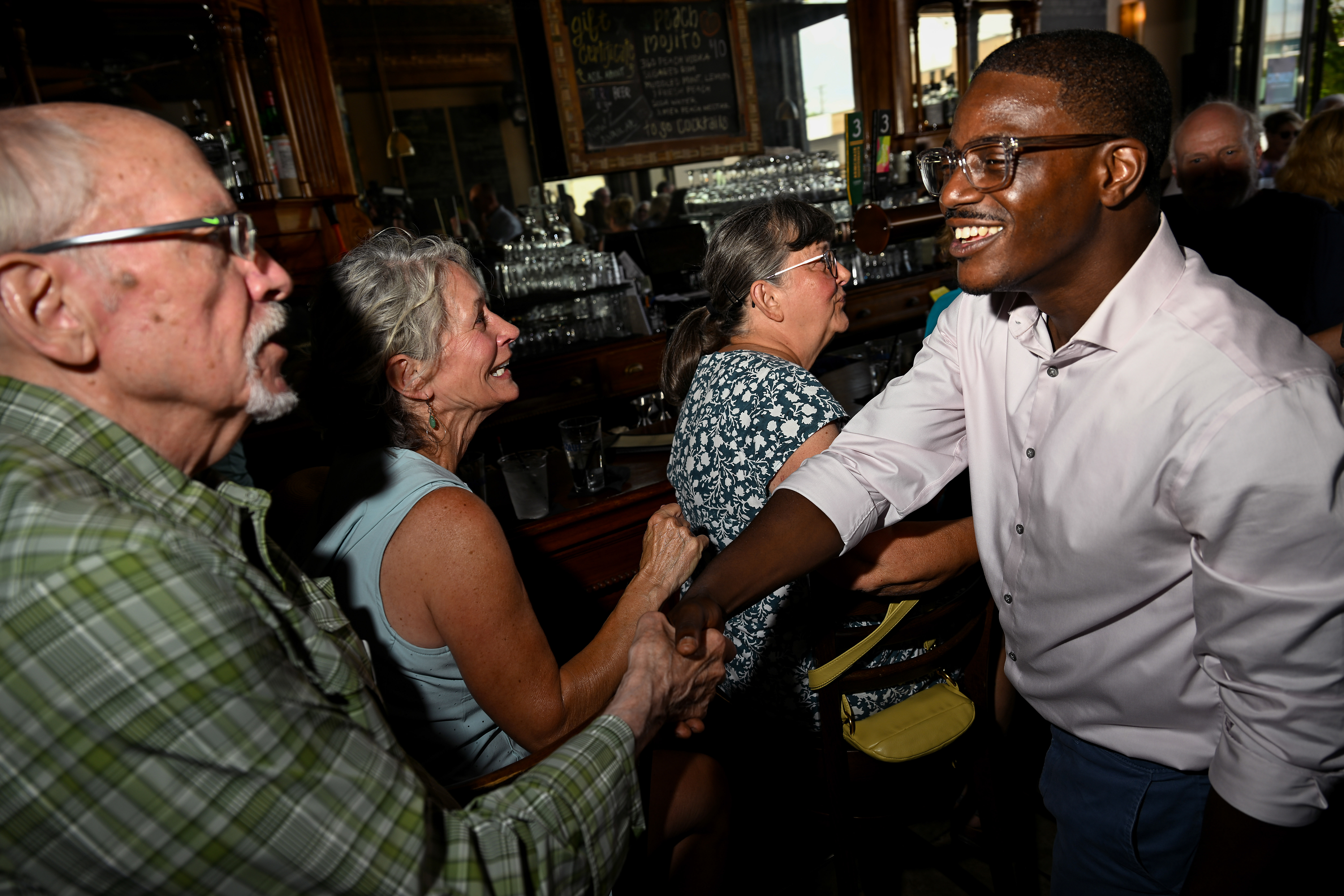 Wisconsin gubernatorial candidate David Crowley greets people during a campaign stop at Urbane restaurant in Sheboygan, Wisconsin, on Aug. 7, 2026.