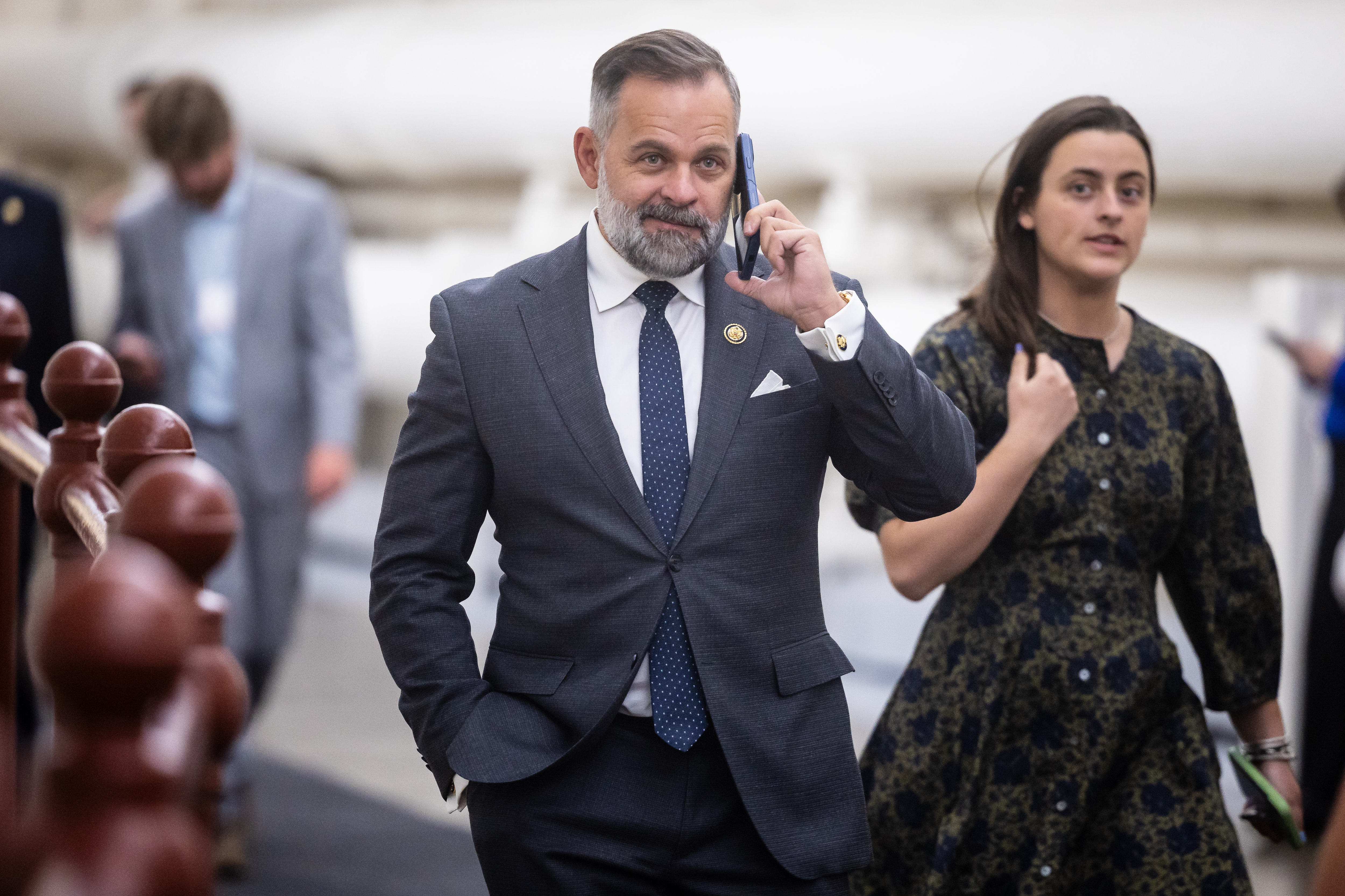 Rep. Cory Mills (R-Fla.) holds a phone to his ear as he walks to a vote at the U.S. Capitol on April 15, 2026. (Francis Chung/POLITICO via AP Images)